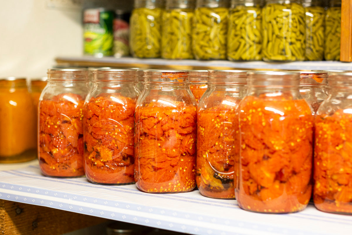 rows of canned veggies in a pantry