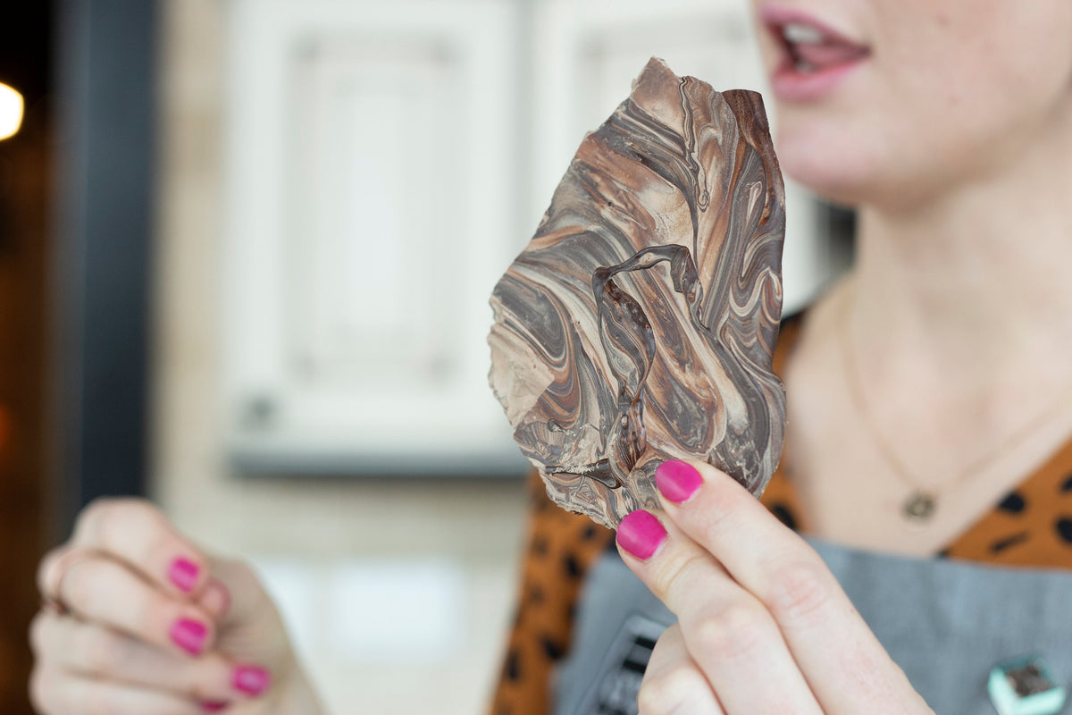 Close-up of chocolate with white streaks caused by chocolate bloom