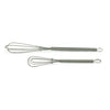 Two mini metal whisks on a white background