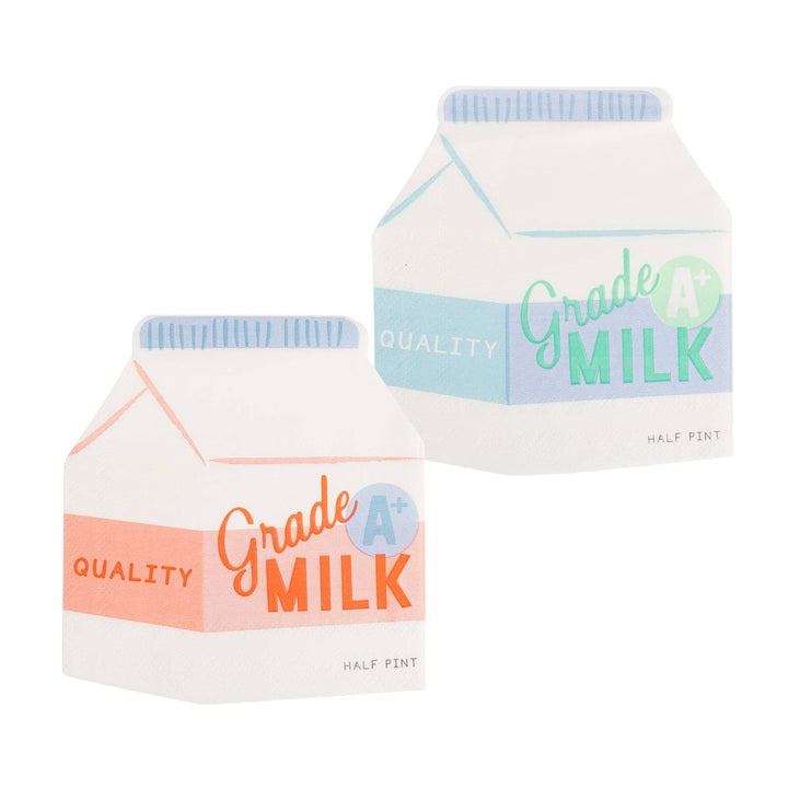 Two miniature milk carton napkins with 'Quality Grade A Milk' text on a white background