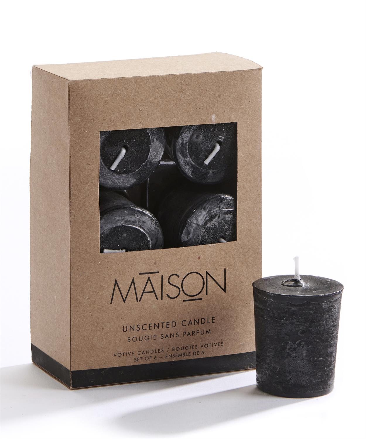 Black unscented candle in front of a cardboard box packaging with 'MAISON' branding.