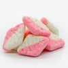 Pink and white diamond-shaped candy on a white background