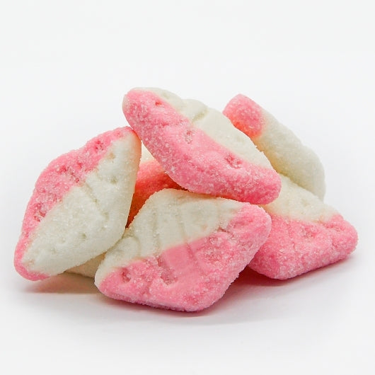 Pink and white diamond-shaped candy on a white background