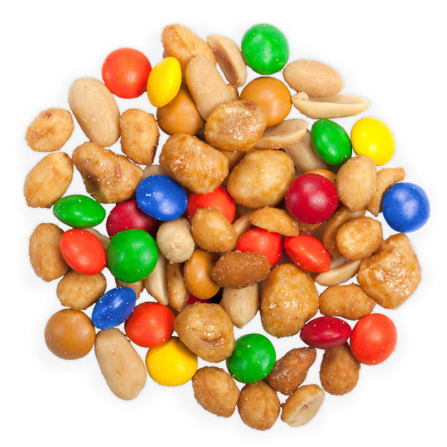 Assorted colorful candy and nuts on a white background
