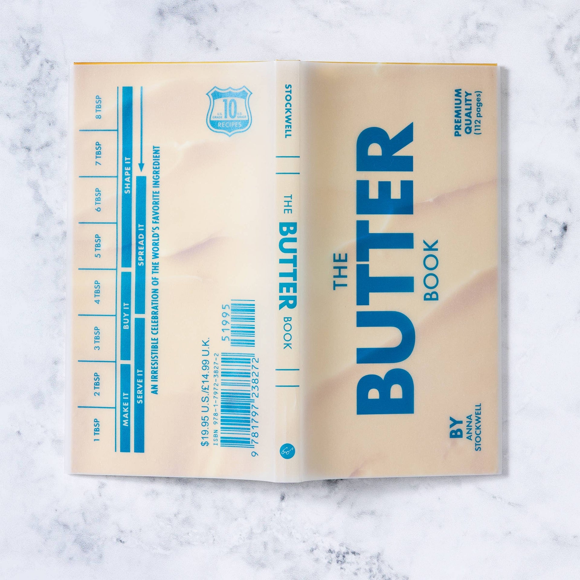 Book titled 'The Butter Book' on a marble surface