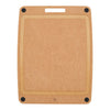 Brown cutting board with black corners and deep juice groove on a white background