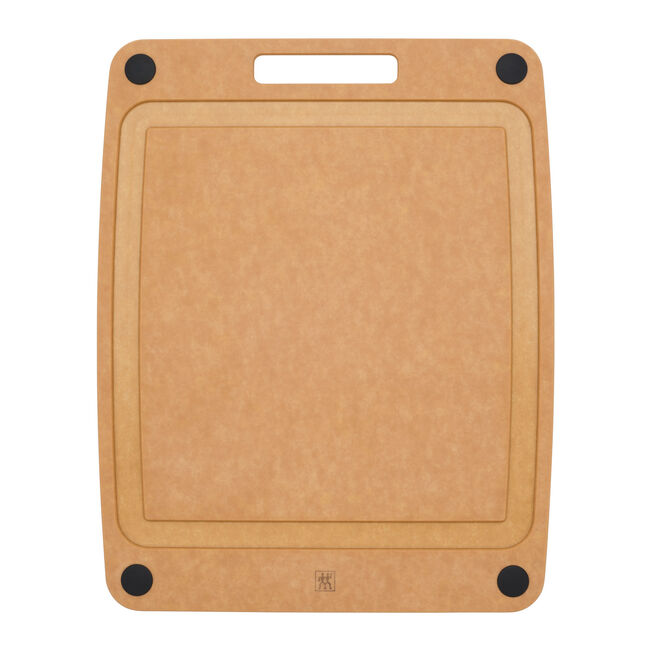 Brown cutting board with black corners and deep juice groove on a white background
