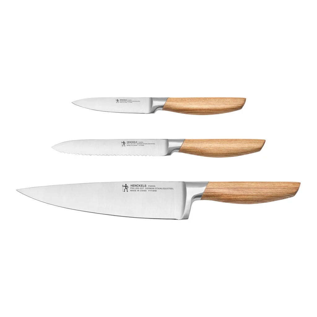 Set of three knives with wooden handles on a white background