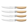 Set of four steak knives with wooden handles on a white background