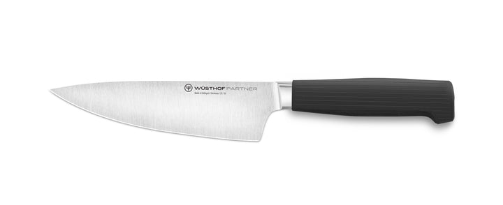 Chef knife with black handle on white background.