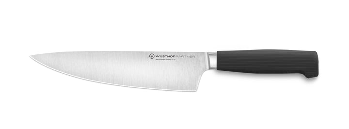 Chef's knife with black handle on a white background