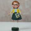Figurine of a girl in a school uniform holding a book and pencil on a plain background