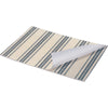 Striped mat with a white paper roll on a white background