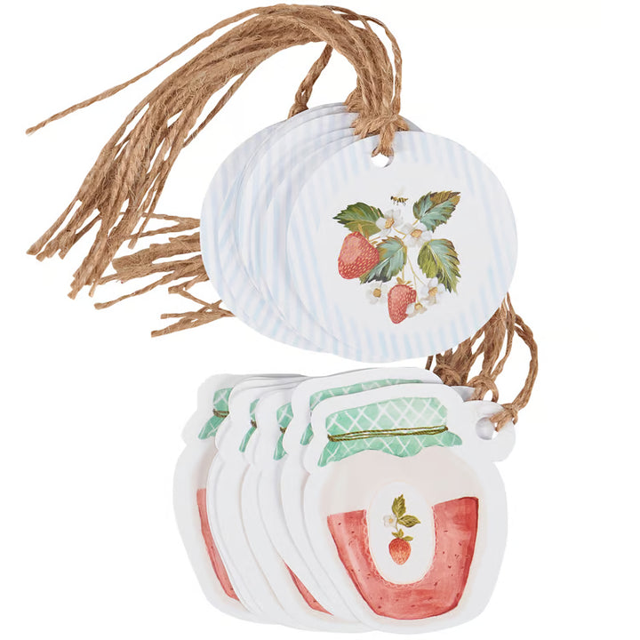 Decorative tags with strawberry design and string on a white background