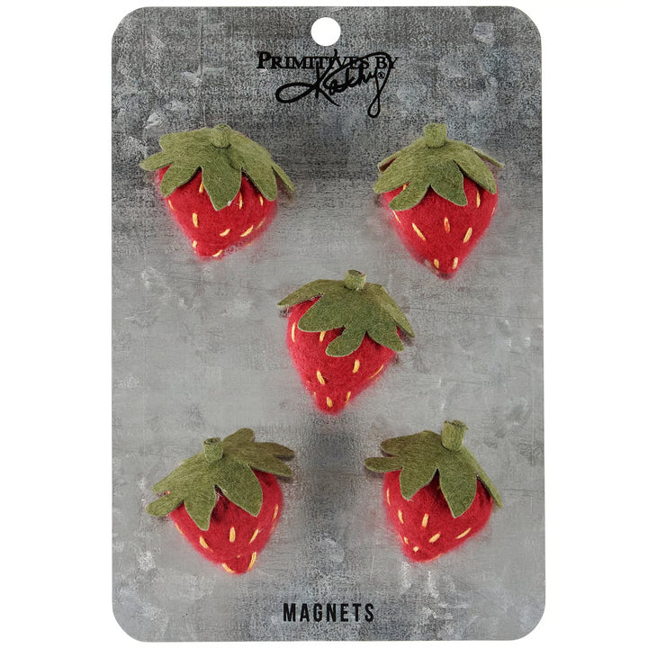Set of strawberry-shaped magnets on a branded card