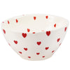 White bowl with red heart patterns on a white background