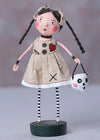 Artistic doll with a unique outfit and accessories on a gray background