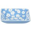 Rectangular ceramic dish with white floral pattern on a blue background