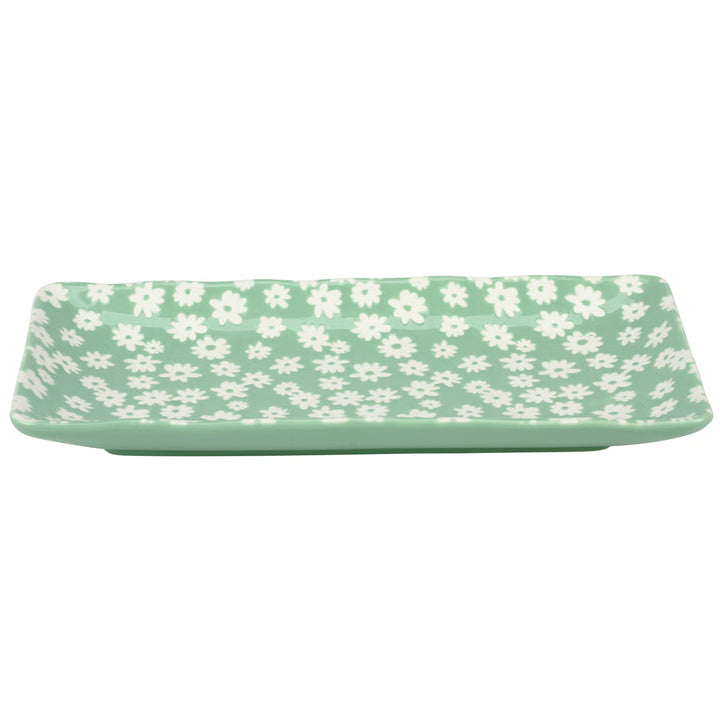 Rectangular tray with white floral pattern on a light green background