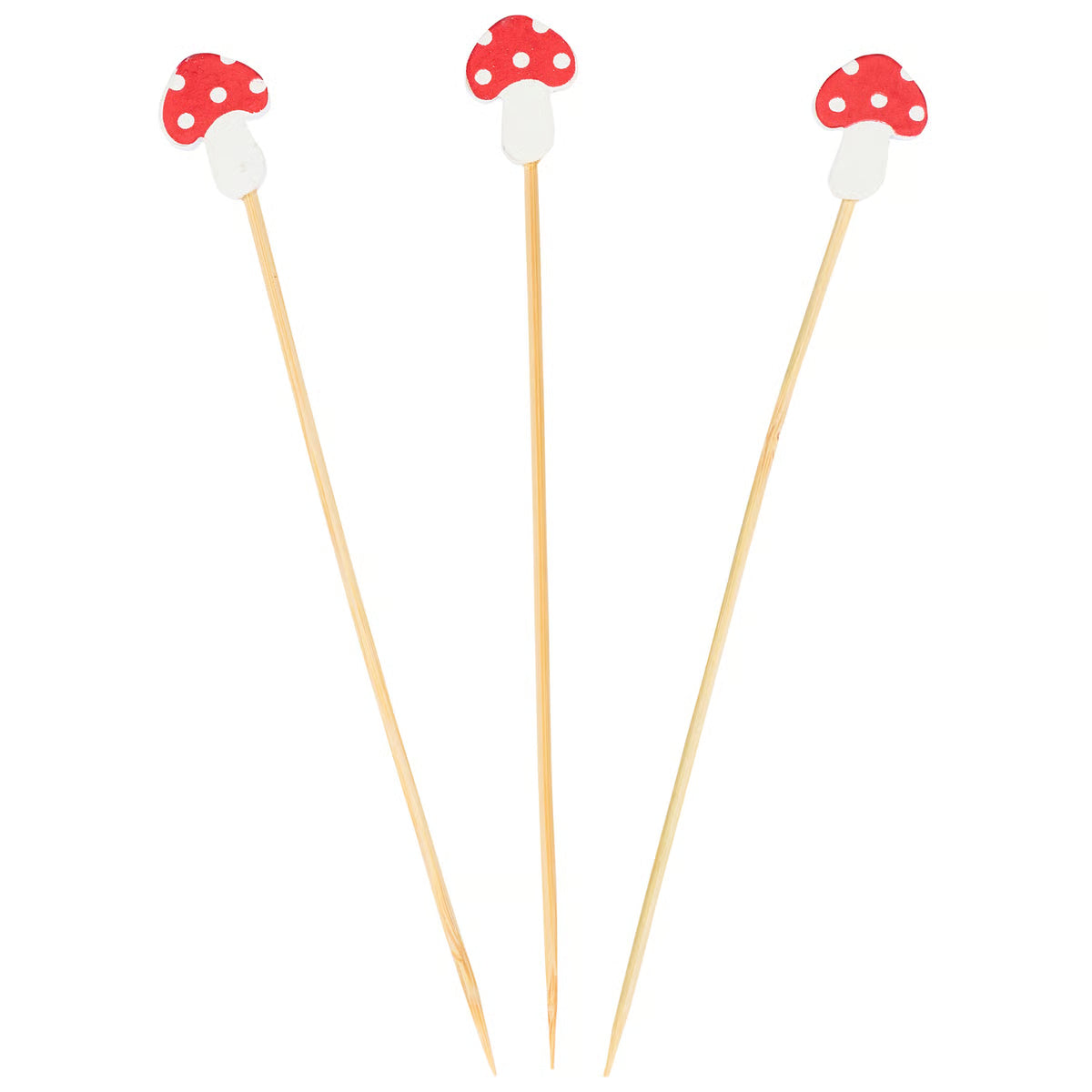 Three wooden skewers with mushroom-shaped ends on a white background