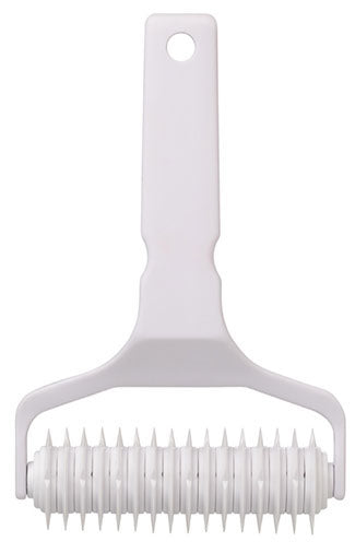 White lattice cutter with handle on a white background