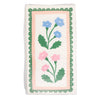 Napkin with floral design on a white background with green, pink, and blue colors.