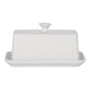 White butter dish with textured surface on a white background