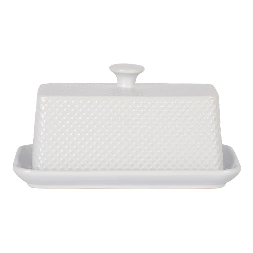White butter dish with textured surface on a white background