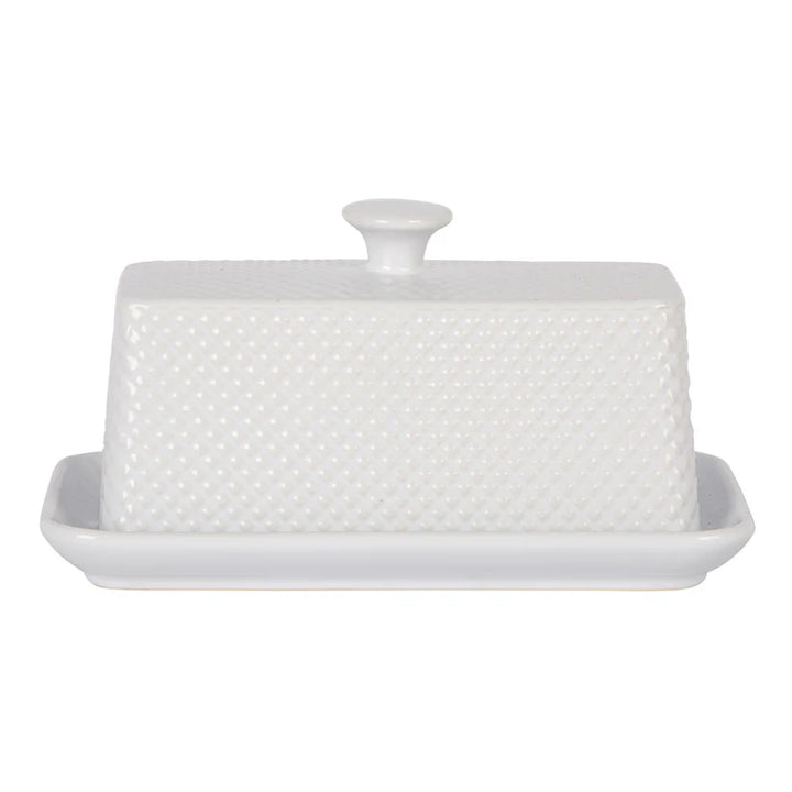 White butter dish with textured surface on a white background