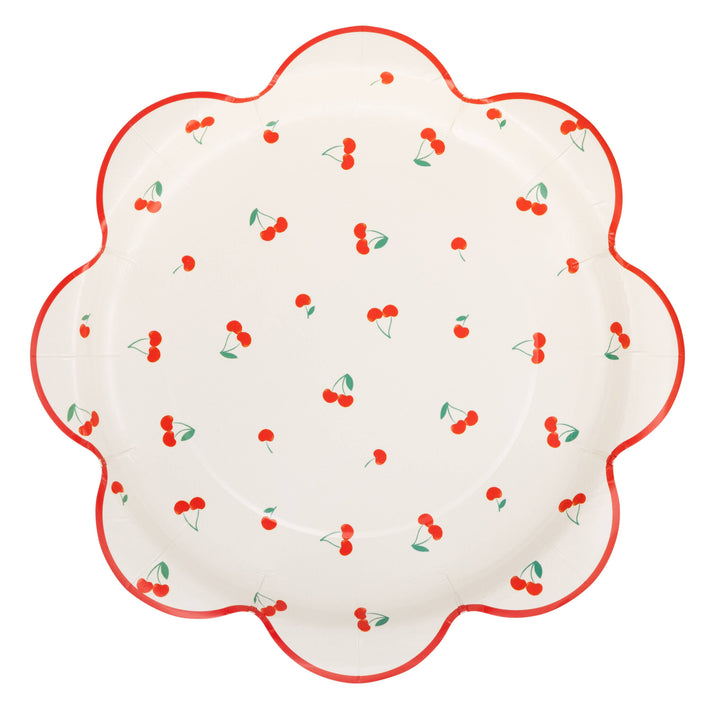 Decorative scalloped edge paper plate with cherry pattern on a white background