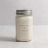 Jar candle labeled 'Fresh Cut Herbs' on a light background