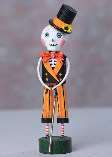 Decorative figure of a skeleton in a top hat and suit on a gray background