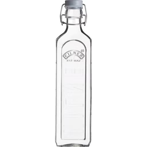 Clear glass bottle with a cap on a white background