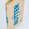 Book titled 'The Butter Book' with blue text on a beige background