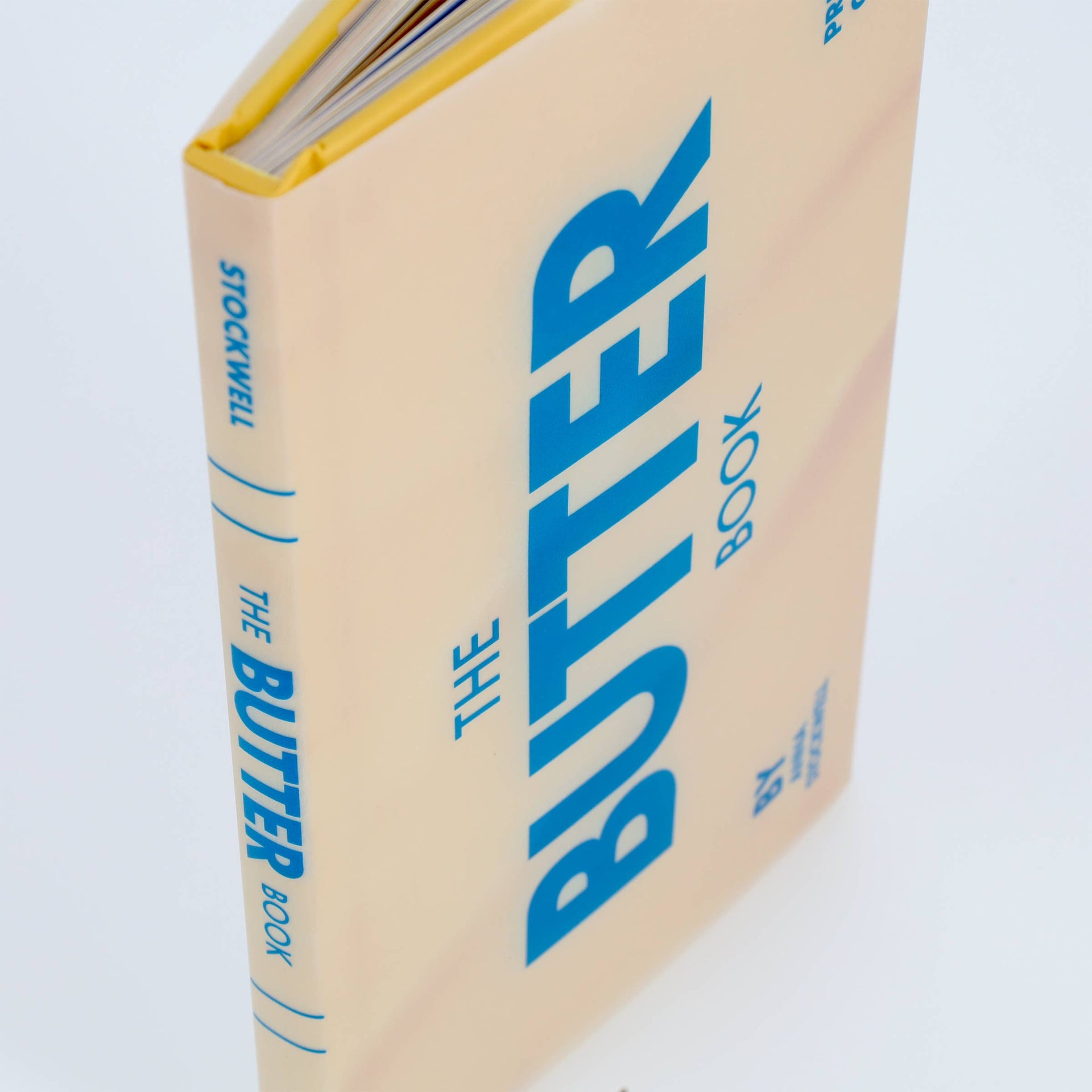 Book titled 'The Butter Book' with blue text on a beige background