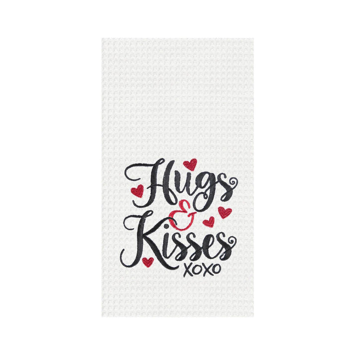 White waffle weave kitchen towel with 'Hugs Kisses XOXO' text on a white background