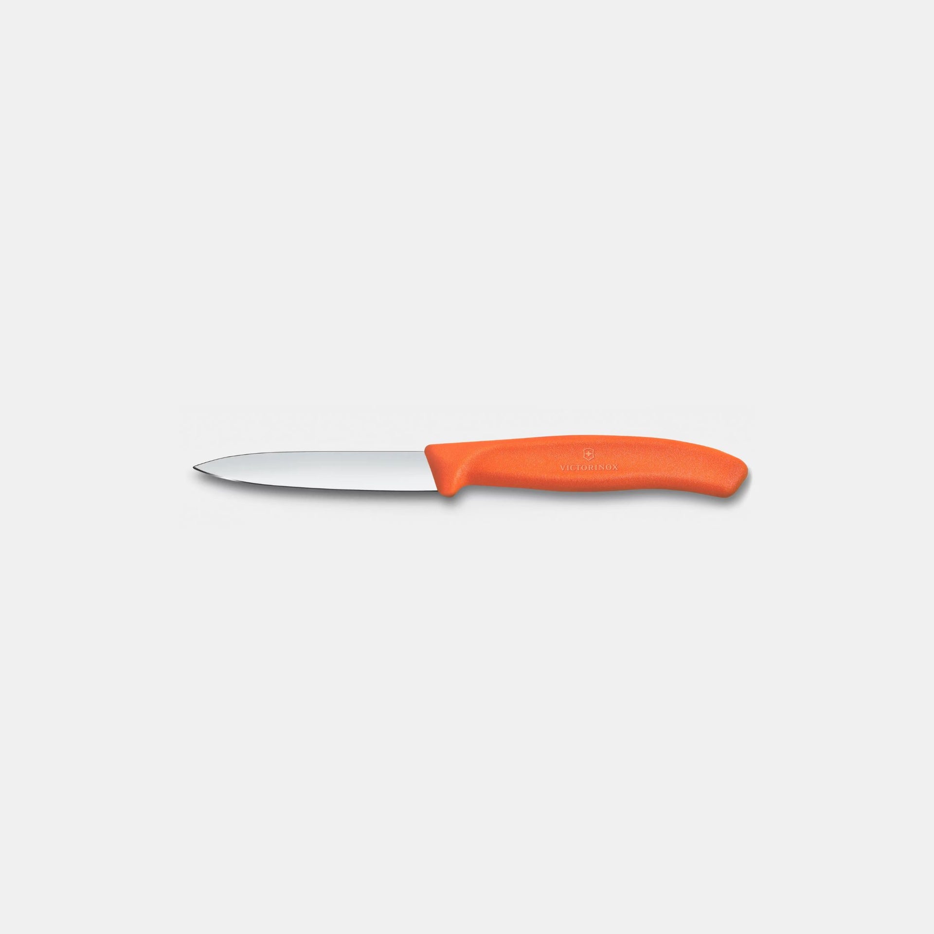 Paring knife with an orange handle on a white background