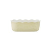 Yellow ceramic pie dish with floral pattern on a white background