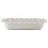 White ceramic baking dish with floral patterns on a white background