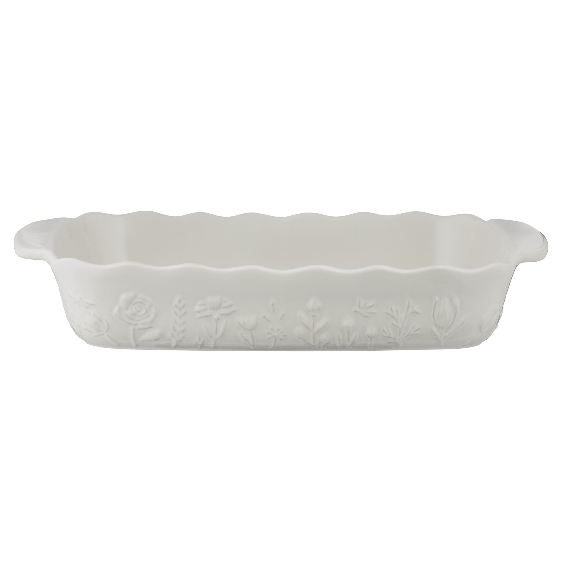 White ceramic baking dish with floral patterns on a white background