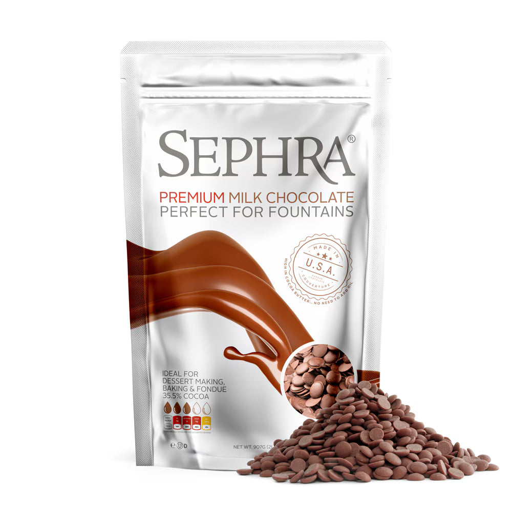 A stand-up pouch of Sephra Premium Milk Chocolate Perfect for Fountains, shown on a white background with a pile of chocolate fountain beans in front.