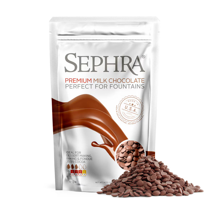 A stand-up pouch of Sephra Premium Milk Chocolate Perfect for Fountains, shown on a white background with a pile of chocolate fountain beans in front.