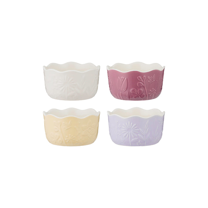 Set of four floral ceramic ramekins in pastel colors on a white background