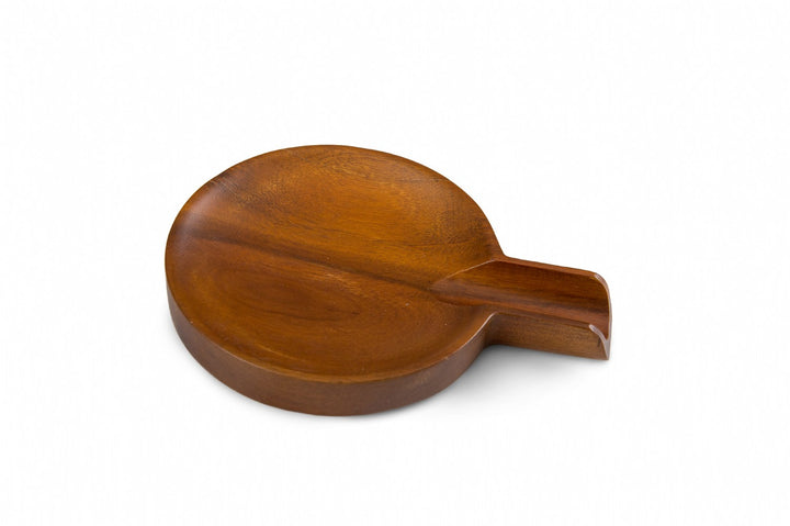 Wooden spoon rest on a white background