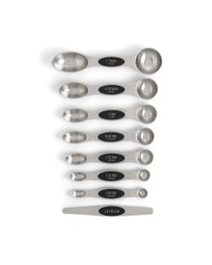 Set of stainless steel measuring spoons with black labels on a white background