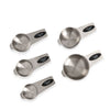 Set of five stainless steel measuring cups with black labels on a white background