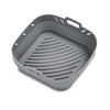 Gray silicone basket with textured surface on a white background