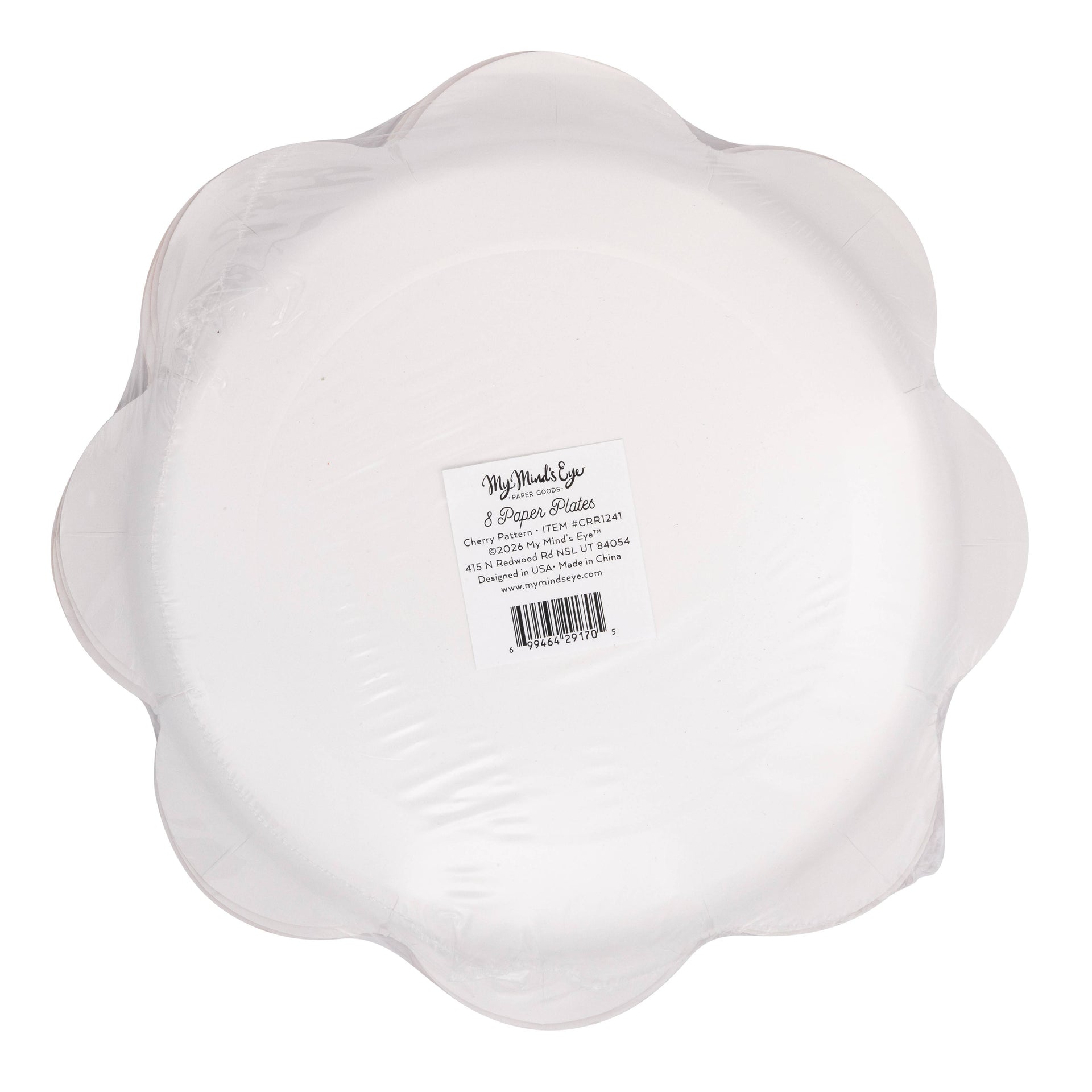 Back side view of scalloped paper plate with a label on a white background