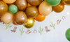 Colorful balloons with cowboy-themed decorations on a white background