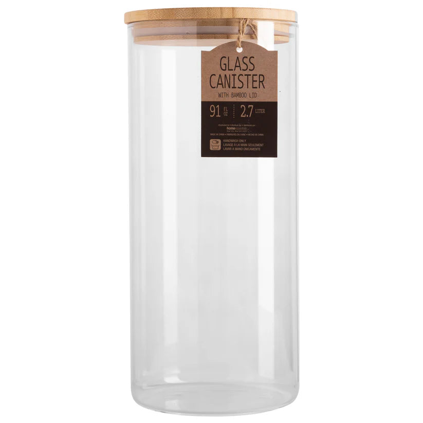 Glass canister with a wooden lid on a white background